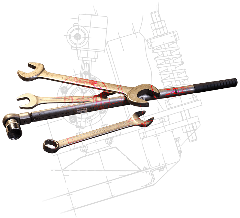 Mehrere Schraubenschlüssel mit überlagertem Bauplan
